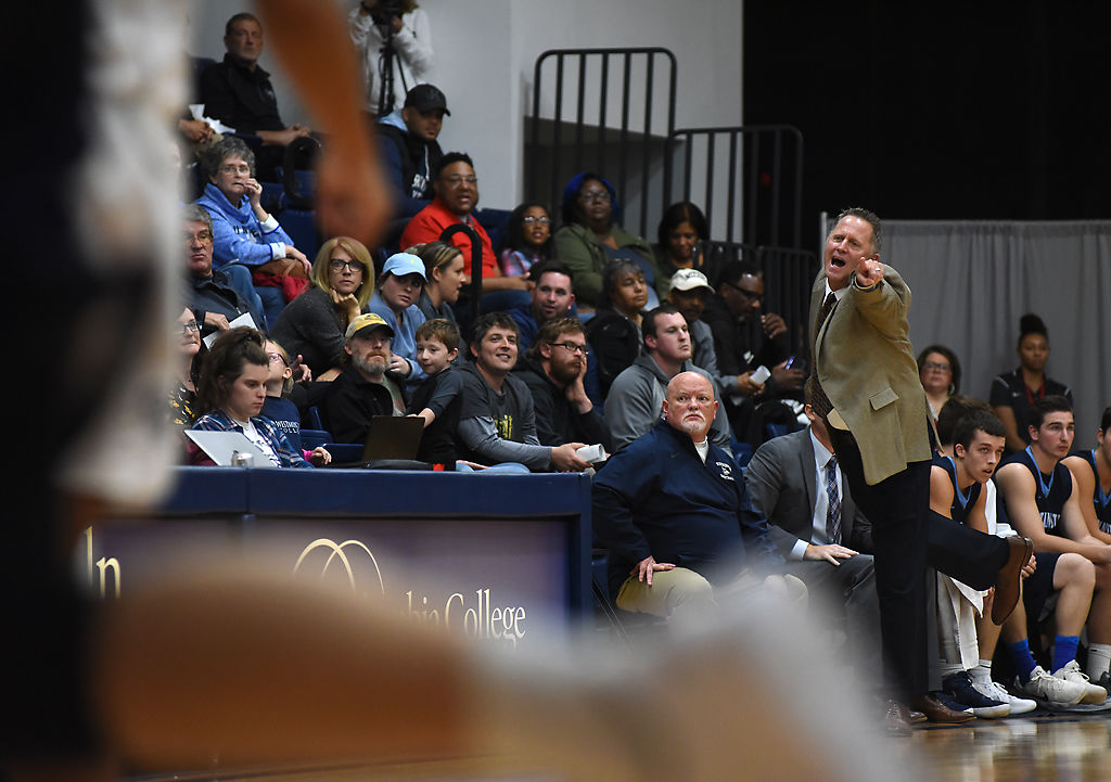 Westminster College Head Coach Matt Mitchell yells to his team
